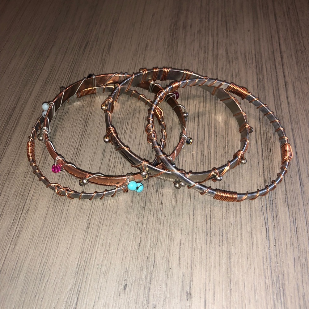 Set of Four Metal and Copper Wire Bracelets
